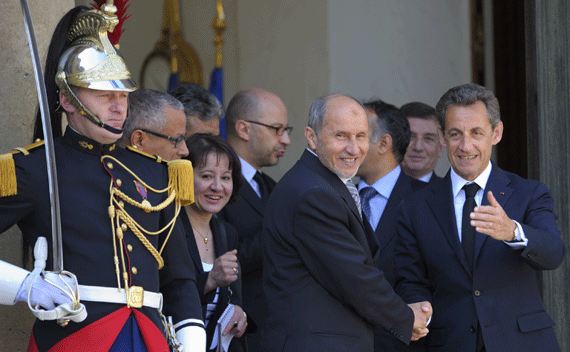 France’s President Nicolas Sarkozy shakes hands with Mustafa Abdel Jalil, head of the main Libyan rebel council, as he leaves the Elysee Palace on April 20, 2011. (Philippe Wojazer/courtesy Reuters)