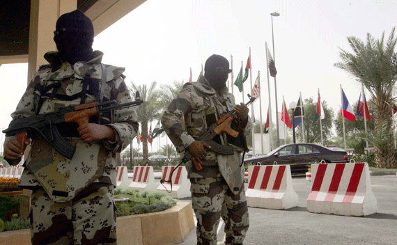 Saudi security forces stand guard outside a hotel in Riyadh.