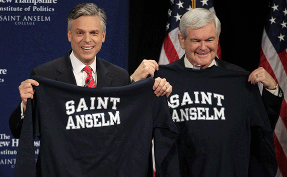 Jon Huntsman (L) and former U.S. House Speaker Newt Gingrich, hold up sweatshirts given to them as gifts following their Lincoln-Douglas style debate at St. Anselm College in Manchester, New Hampshire December 12, 2011. REUTERS/Brian Snyder 
