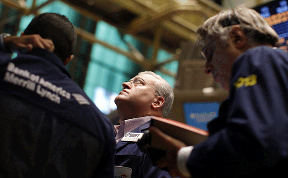 Traders work on the main trading floor of the New York Stock Exchange on July 29, 2011. U.S. stocks dropped for a fifth straight day on Friday after weak data on the economy and a setback on a debt deal discouraged investors. (Mike Segar/courtesy Reuters) 