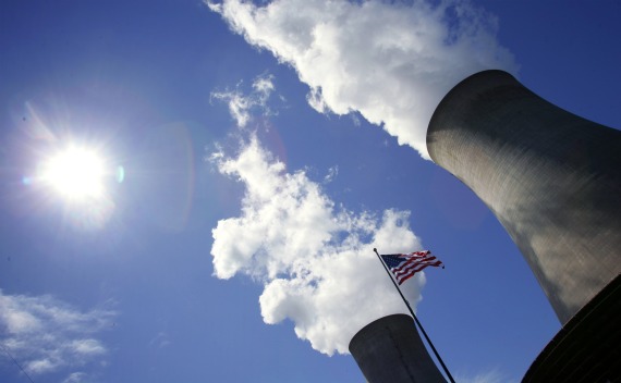 US Flag in Front of Cooling Towers