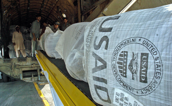 Pakistani workers unloads relief goods sent by the U.S. Agency for International Development (USAID). 