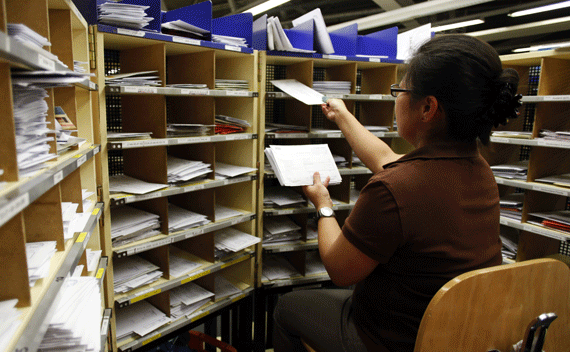 An Austrian Post employee sorts letters in Vienna. (Leonhard Foeger/courtesy Reuters)