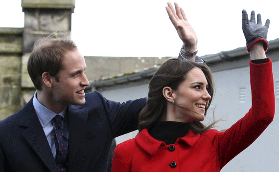 Prince William and Kate Middleton wave during a visit to St. Andrews University on February 25, 2011. 