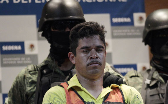 Soldiers escort Julian Zapata Espinoza, a ring leader of a cell of Los Zetas, who was arrested in connection with the roadside killing of a U.S. Immigration and Customs Enforcement agent in Mexico last week. (Henry Romero/courtesy Reuters).