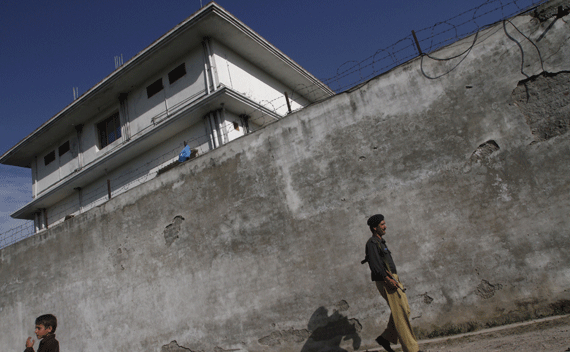 A policeman walks in front of the compound where al-Qaeda leader Osama bin Laden was killed in Abbottabad. 