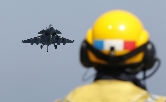 A French jet returns from a mission in Libya to the aircraft carrier Charles de Gaulle. (Benoit Tessier/courtesy Reuters)