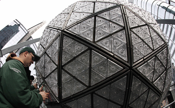 A worker installs some of the 288 new Waterford crystals, featuring this year’s ’Let There Be Friendship’ design, on the Times Square New Year’s Eve Ball atop One Times Square in New York December 27, 2011. Thousands are expected to pack Times Square on New Year’s Eve to watch the annual ball drop at midnight marking the beginning of 2012. REUTERS/Mike Segar 