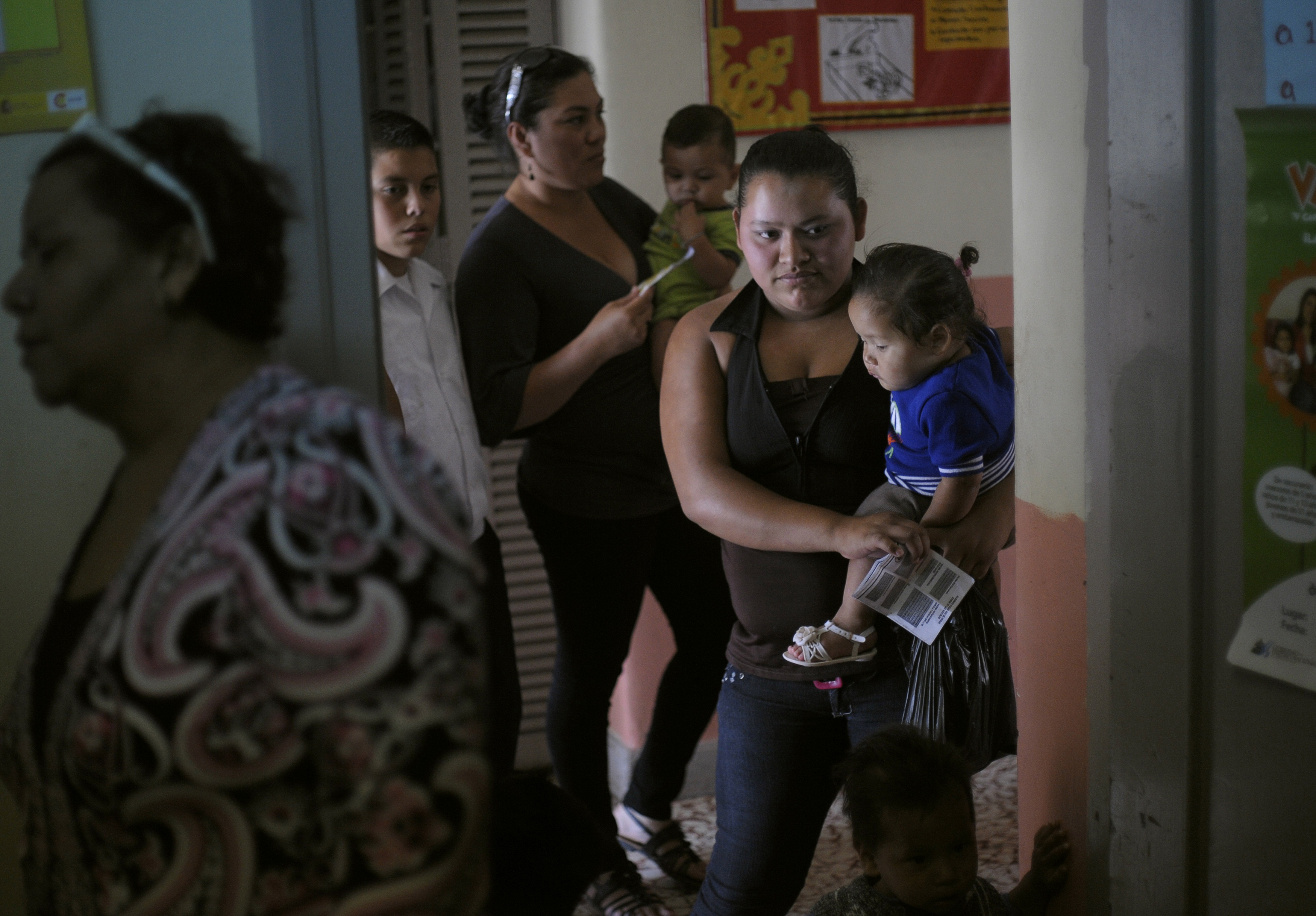Women and their children wait in line to receive a polio vaccine shot at a health centre in Tegucigalpa, Honduras.