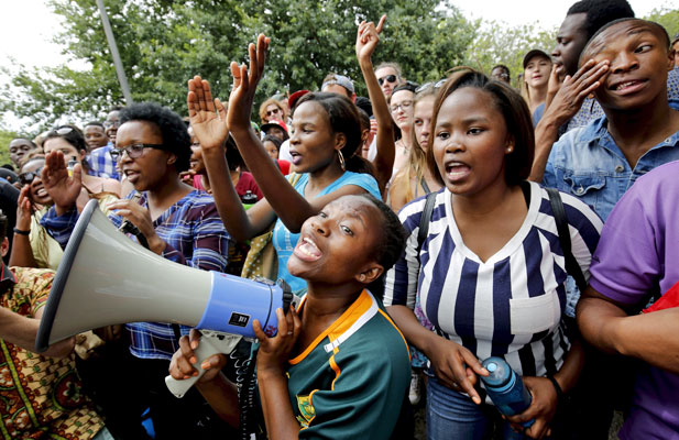 White workers in S. Africa protest against discrimination by black-only  share scheme