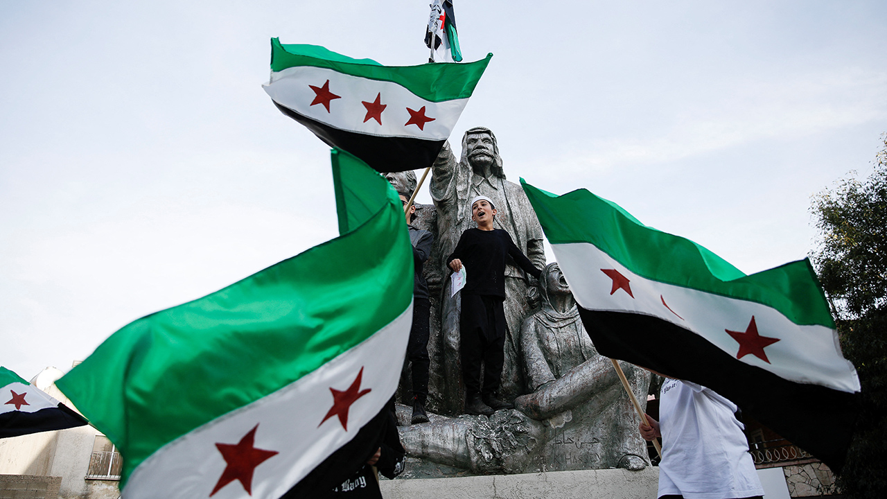 People celebrate after Syrian rebels announced that they had ousted President Bashar al-Assad, in Majdal Shams, an Israeli-occupied Druze village in Golan Heights.