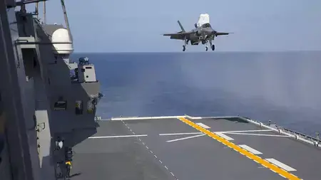 A U.S. Marine Corps F-35B Lightning II aircraft conducts a vertical landing aboard the Japanese Ship Izumo off the coast of Japan in October 2021.