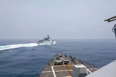 Chinese warship Luyang III sails past U.S. destroyer USS Chung-Hoon in the Taiwan Strait, as seen from the deck of the USS Chung-Hoon, on June 3, 2023.