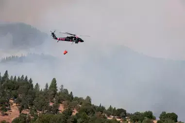 California Army National Guard UH-60 Black Hawk helicopter assists in fighting a massive wildfire near Yosemite National Park.