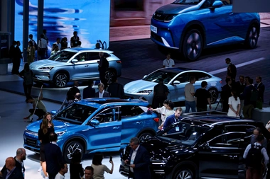 Visitors at the Munich Auto Show looking at EVs by Chinese carmaker BYD, Munich, September 2023