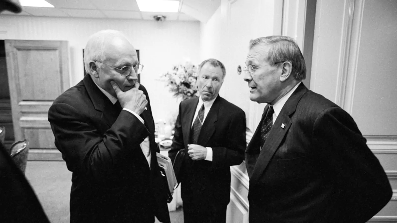 Vice President Dick Cheney, his chief of staff, Scooter Libby, and Secretary of Defense Donald Rumsfeld talk outside the Pentagon briefing room in September 2002.