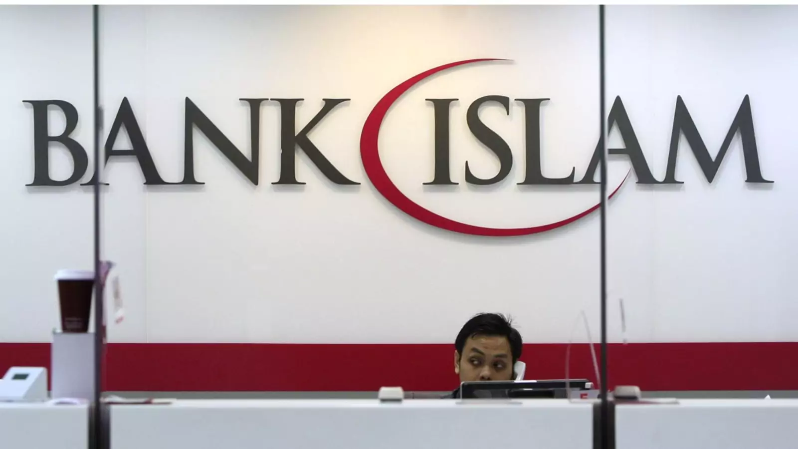 A staffer at the Bank Islam branch office near Kuala Lumpur, Malaysia.