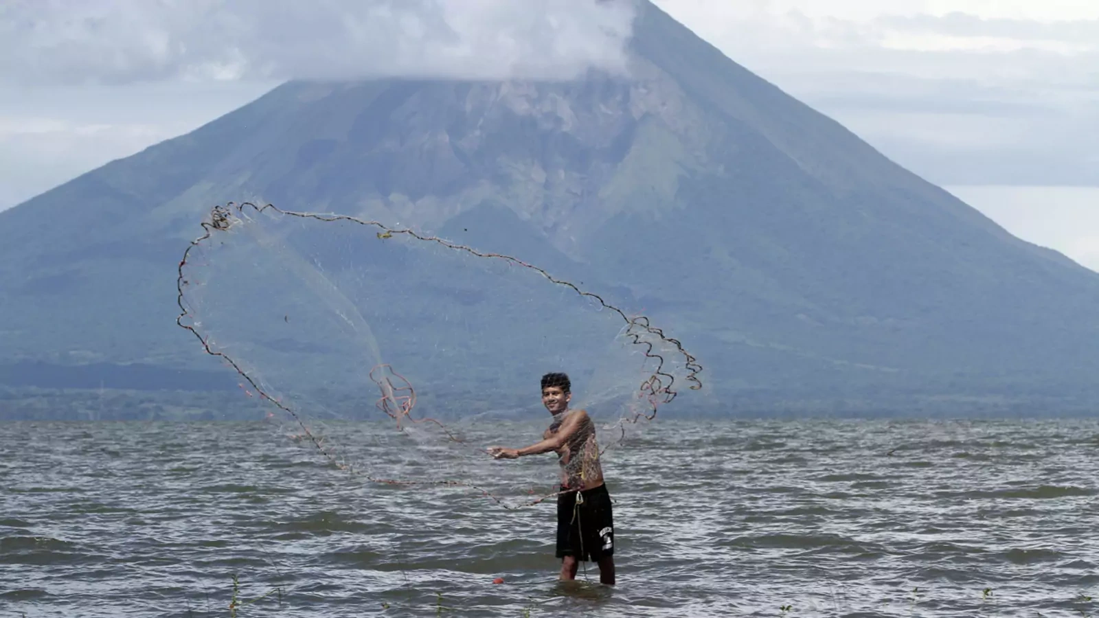 A fisherman casts a fishing net at Lake Cocibolca in Rivas, Nicaragua.