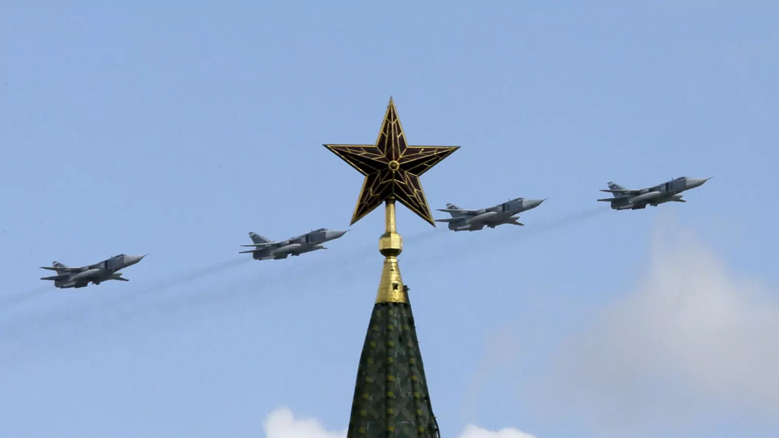 Russian jets fly in formation during rehearsals for the Victory Day military parade, with a tower of the Kremlin seen in the foreground, May 3, 2014.