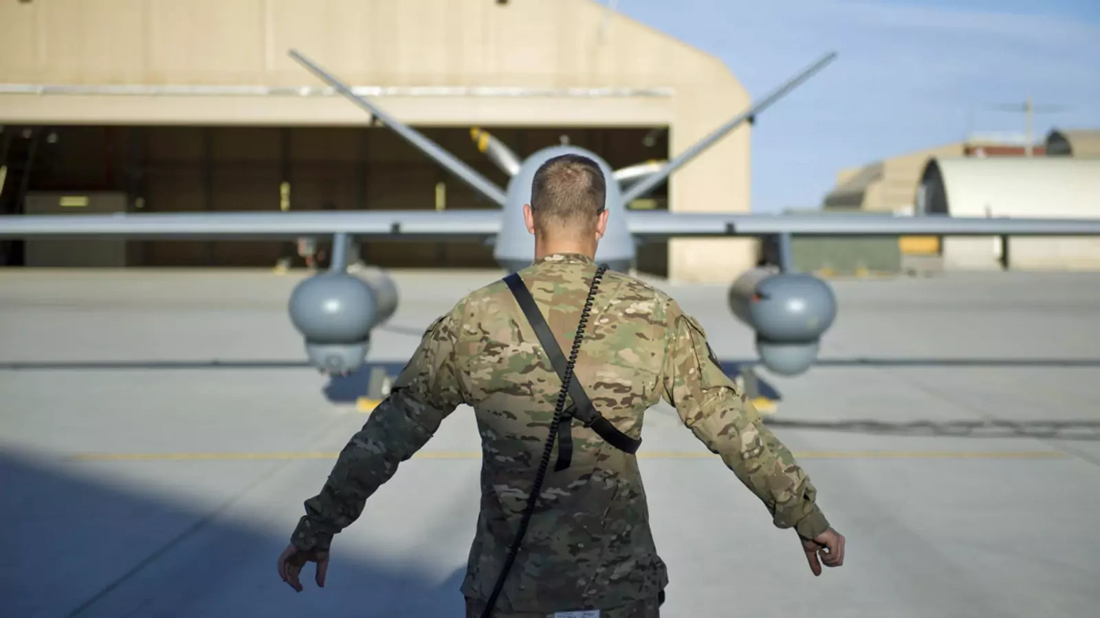 A U.S. airman conducts preflight checks on an MQ-9 Reaper in Afghanistan, 2015.