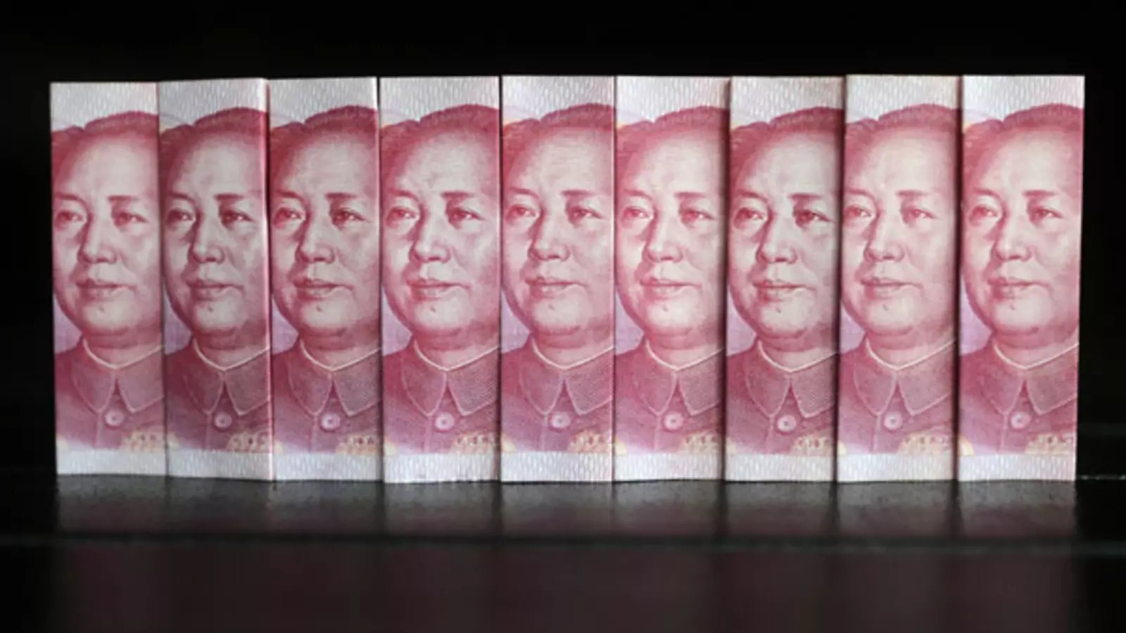 Chinese 100 yuan banknotes are stacked side by side.