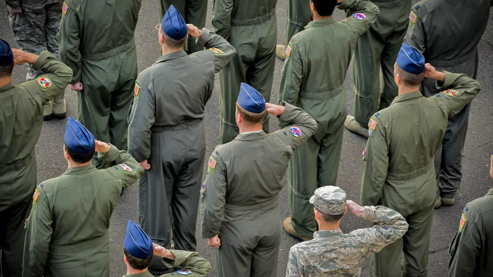 Members of the U.S. Air Force salute during a ceremony at Yokota Air Base, Japan. 