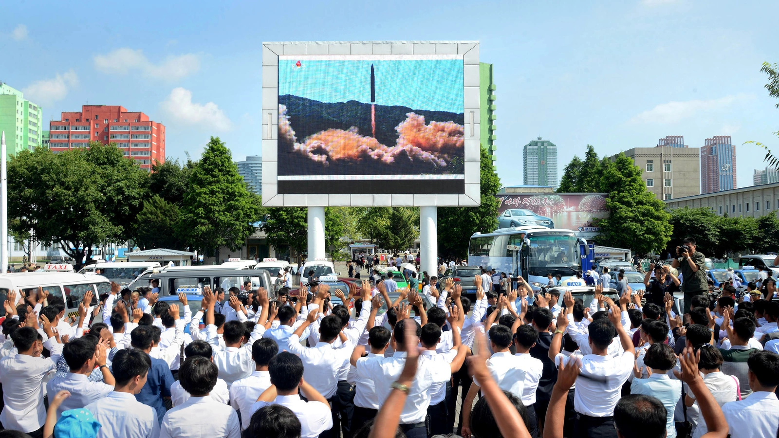 North Koreans watch the test launch of the Hwasong-14 intercontinental ballistic missile.