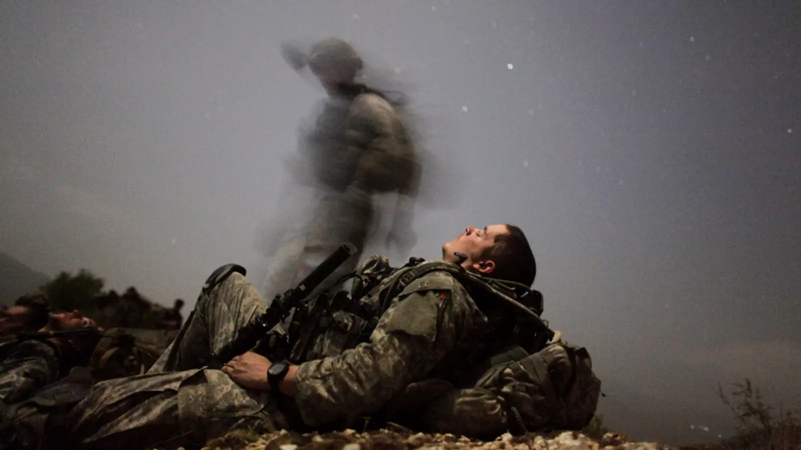 A U.S. soldier takes a break during a night mission in Afghanistan's Pesh valley.