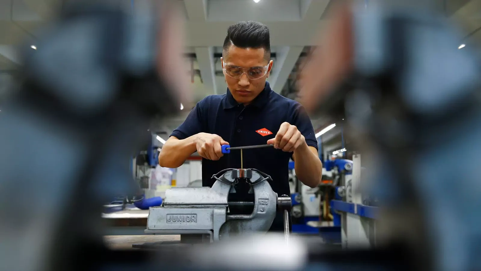 An Afghan refugee participates in a training program at a tools manufacturer in the city of Wuppertal in western Germany.