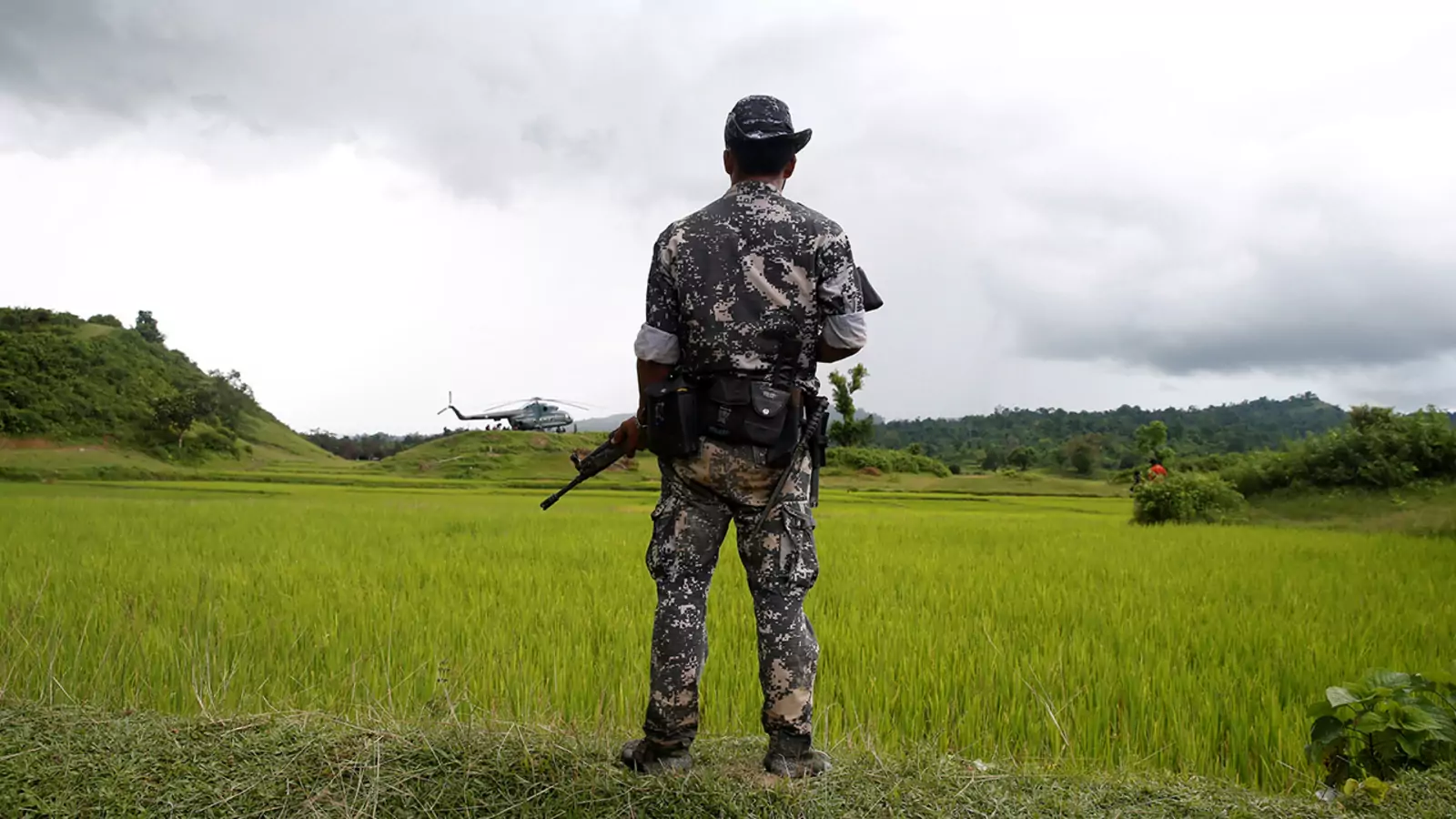 A Myanmar soldier stands near a township in Rakhine State, September 27, 2017. 