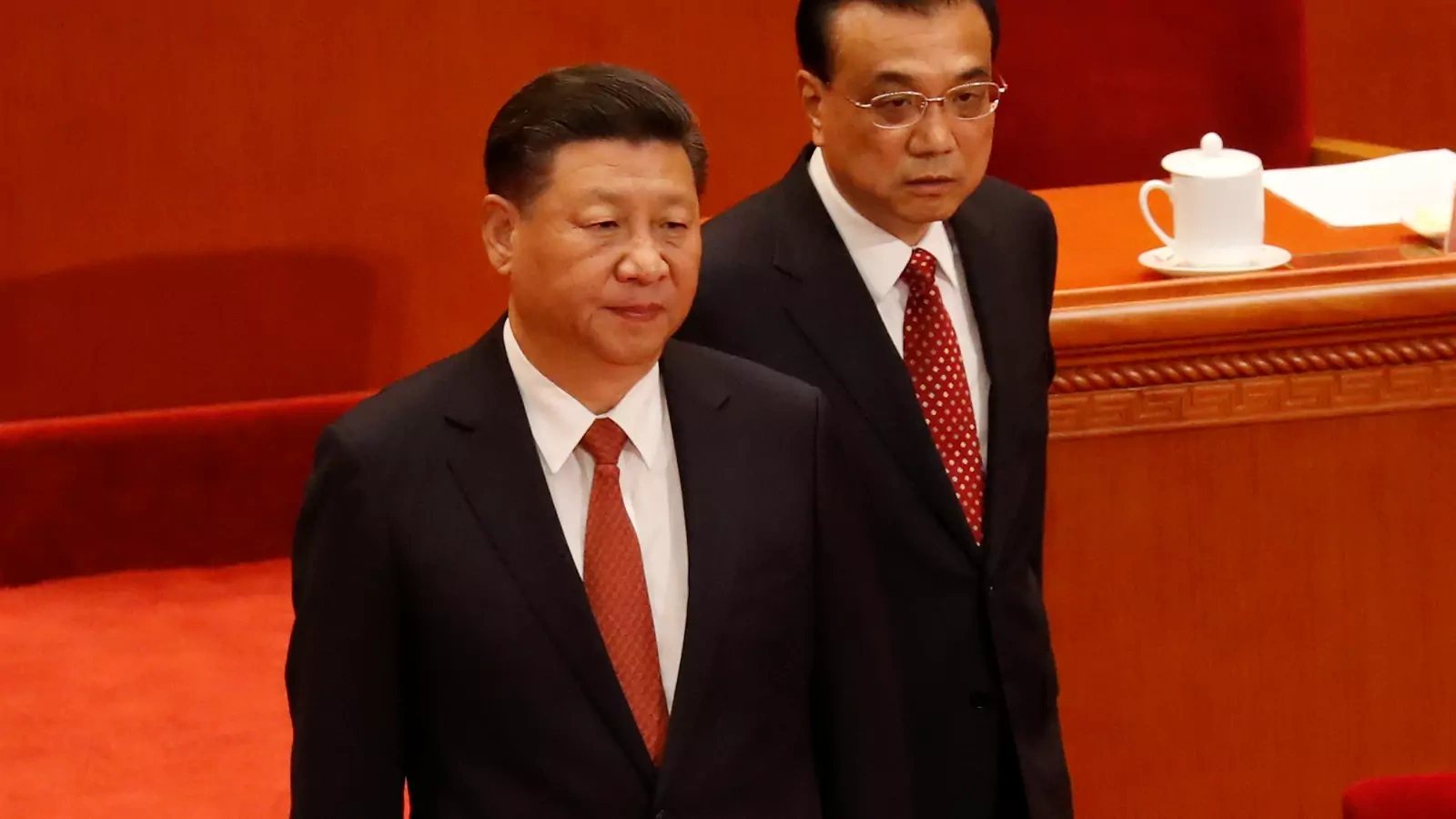 China's President Xi Jinping and Premier Li Keqiang arrive for the ceremony to mark the 90th anniversary of the founding of the China's People's Liberation Army at the Great Hall of the People in Beijing.