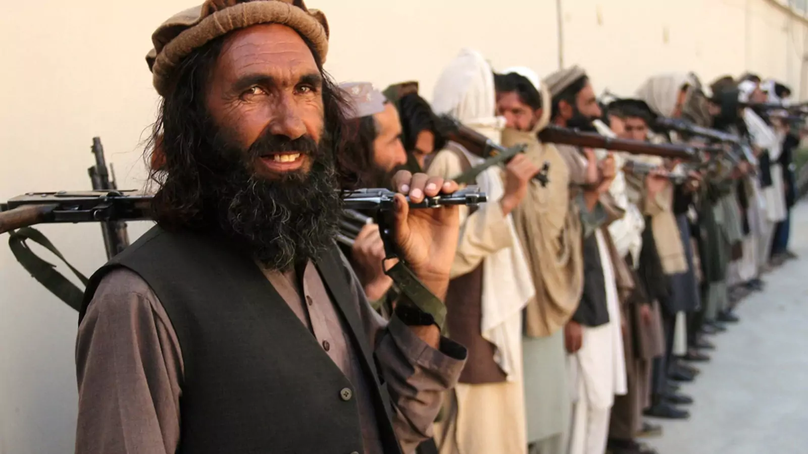 Taliban fighters in eastern Nangarhar Province attend a surrender ceremony in 2016.