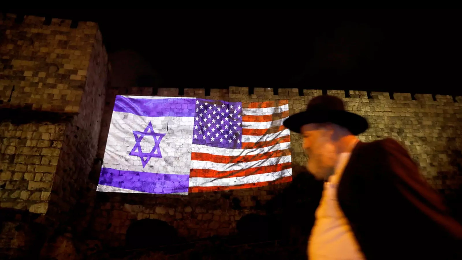 The Israeli and American flags are projected on the walls surrounding Jerusalem’s Old City.