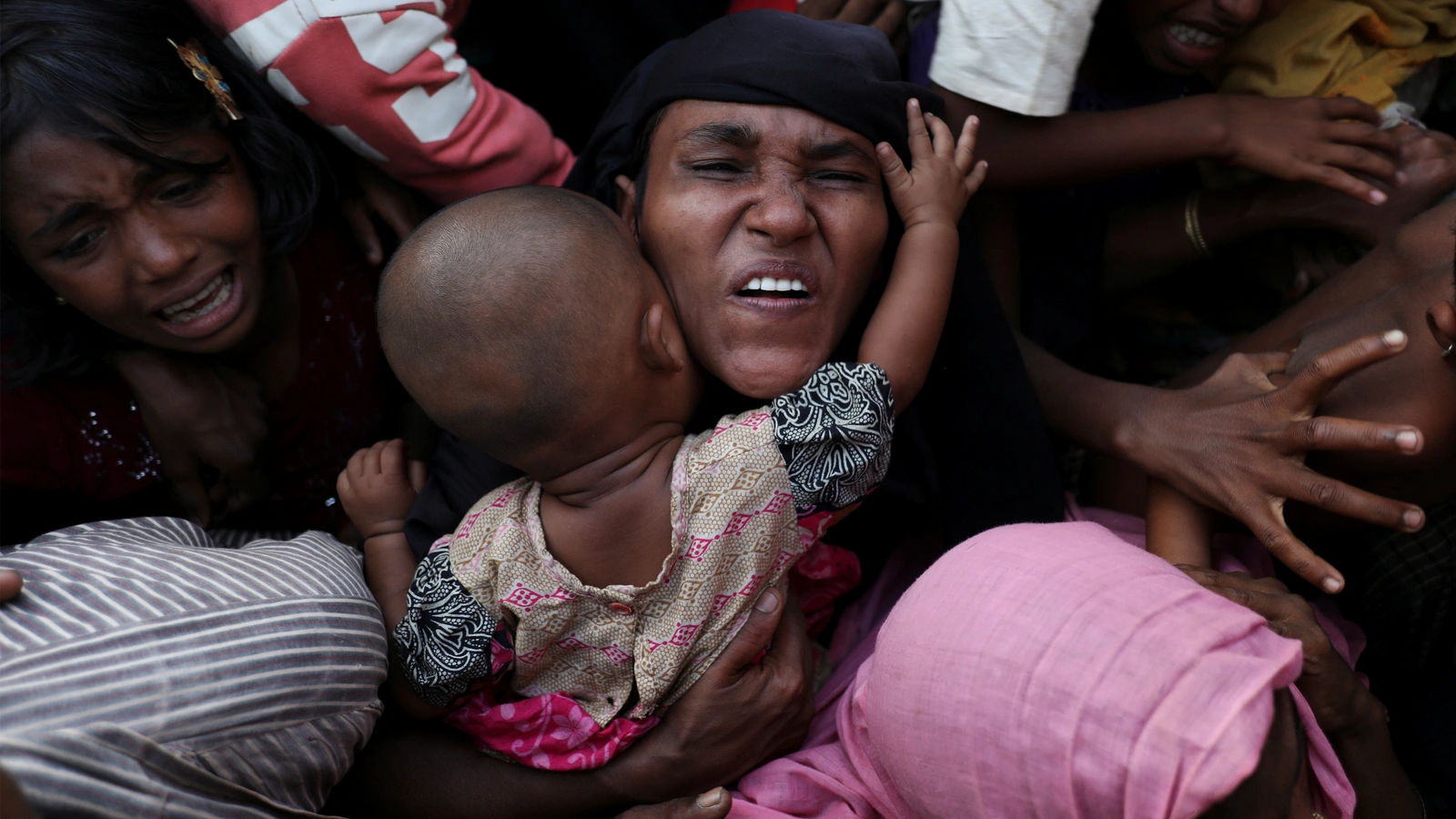 Rohingya refugees wait for aid near Cox’s Bazar, Bangladesh. 