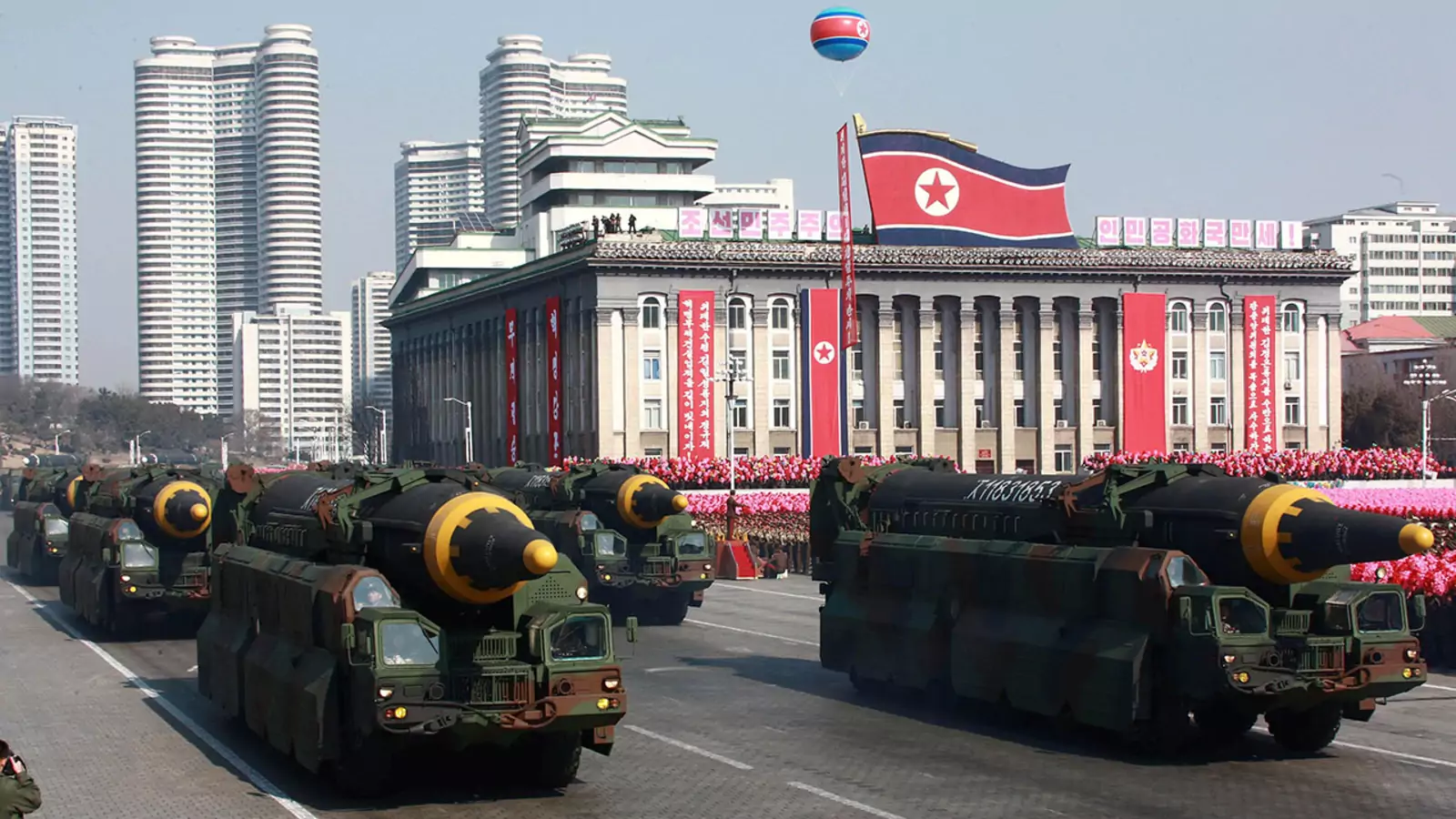 North Korea parades Hwasong-12 intermediate-range ballistic missiles during a 2018 military parade.