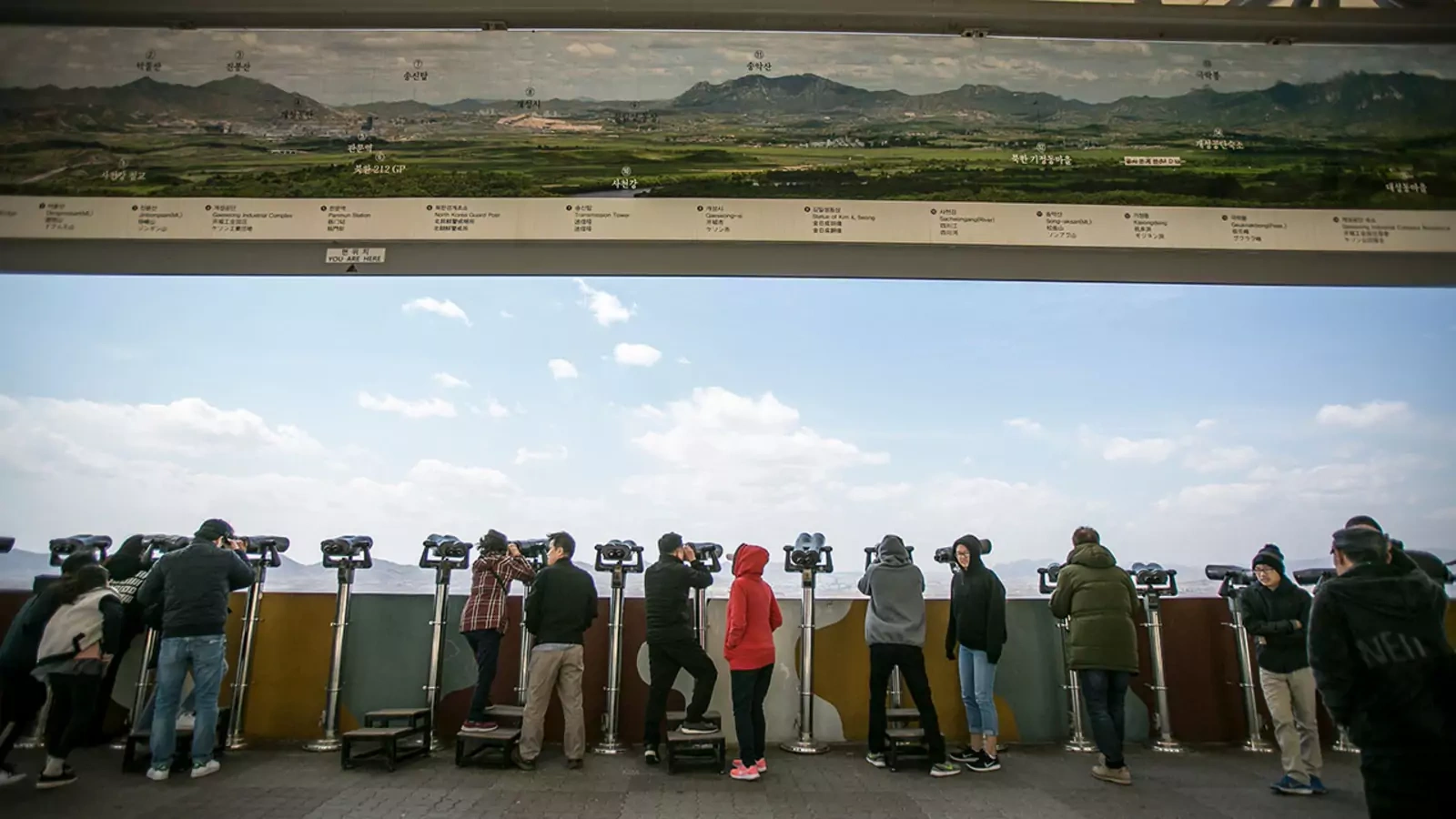 Tourists look toward North Korea from the southern side of the demilitarized zone.