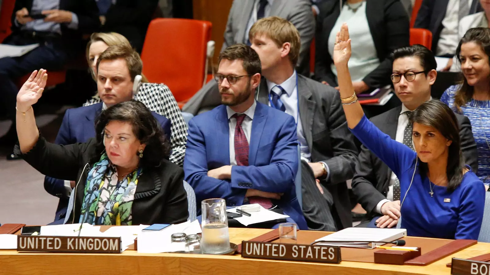 U.S. Ambassador Nikki Haley and UK Ambassador Karen Pierce vote against a Russian resolution condemning “aggression” against Syria during an emergency UN Security Council meeting.