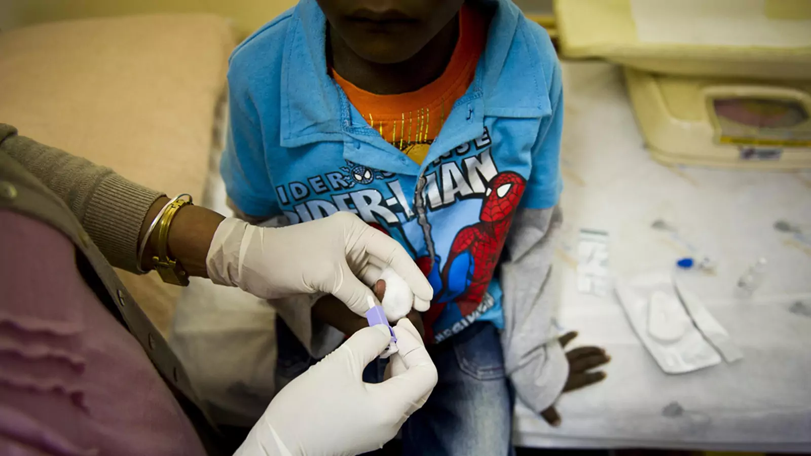 A nurse administers an HIV test on a young boy at a PEPFAR-funded AIDS clinic in Johannesburg, South Africa. 