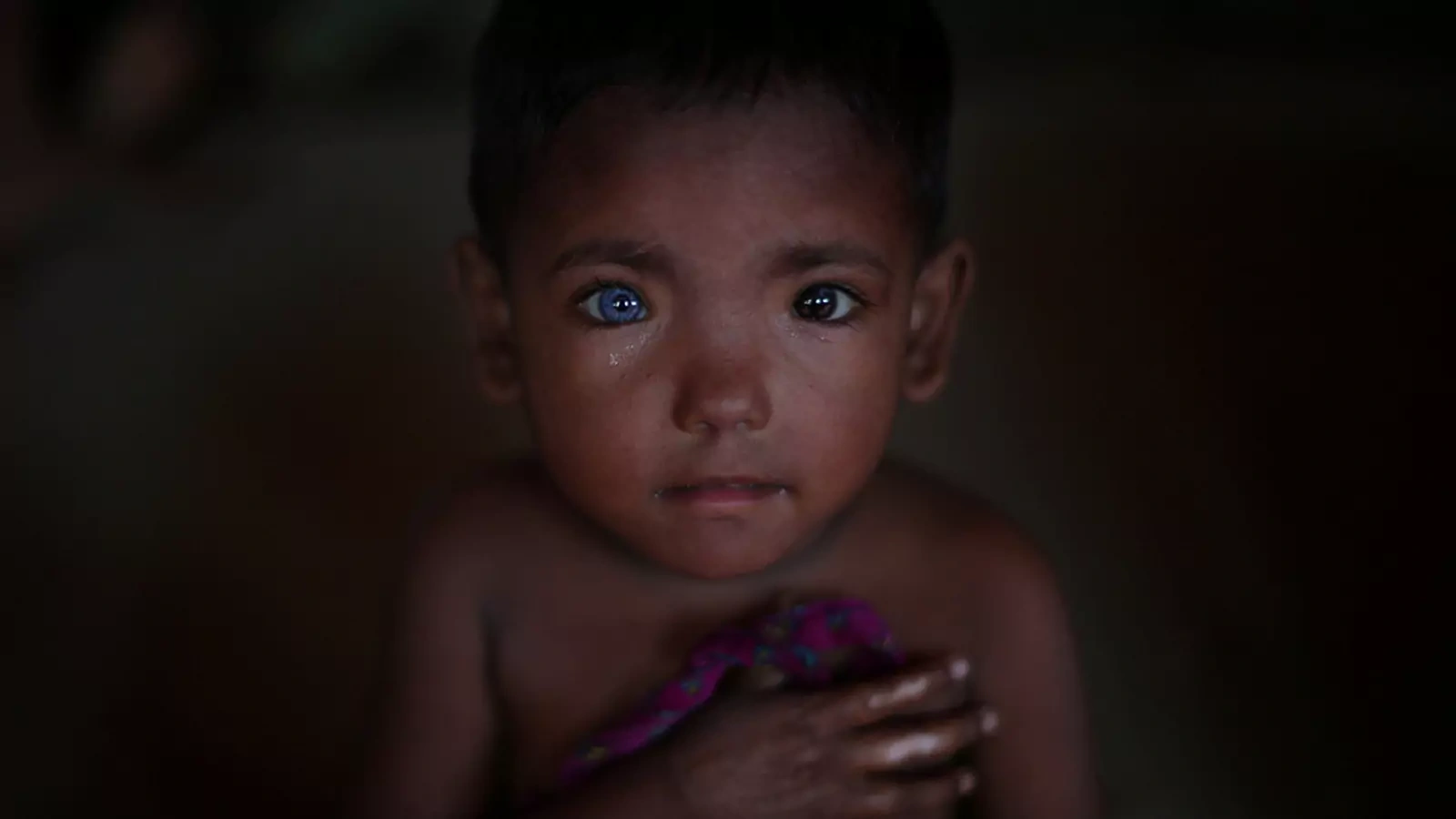 A Rohingya child is seen in a refugee encampment in Bangladesh.