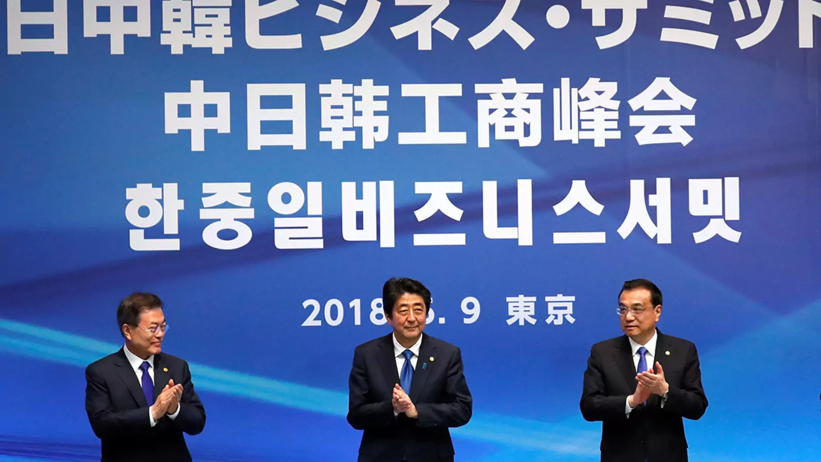 Japanese Prime Minister Shinzo Abe, South Korean President Moon Jae-in, and Chinese Premier Li Keqiang attend a business summit in Tokyo on May 9, 2018.