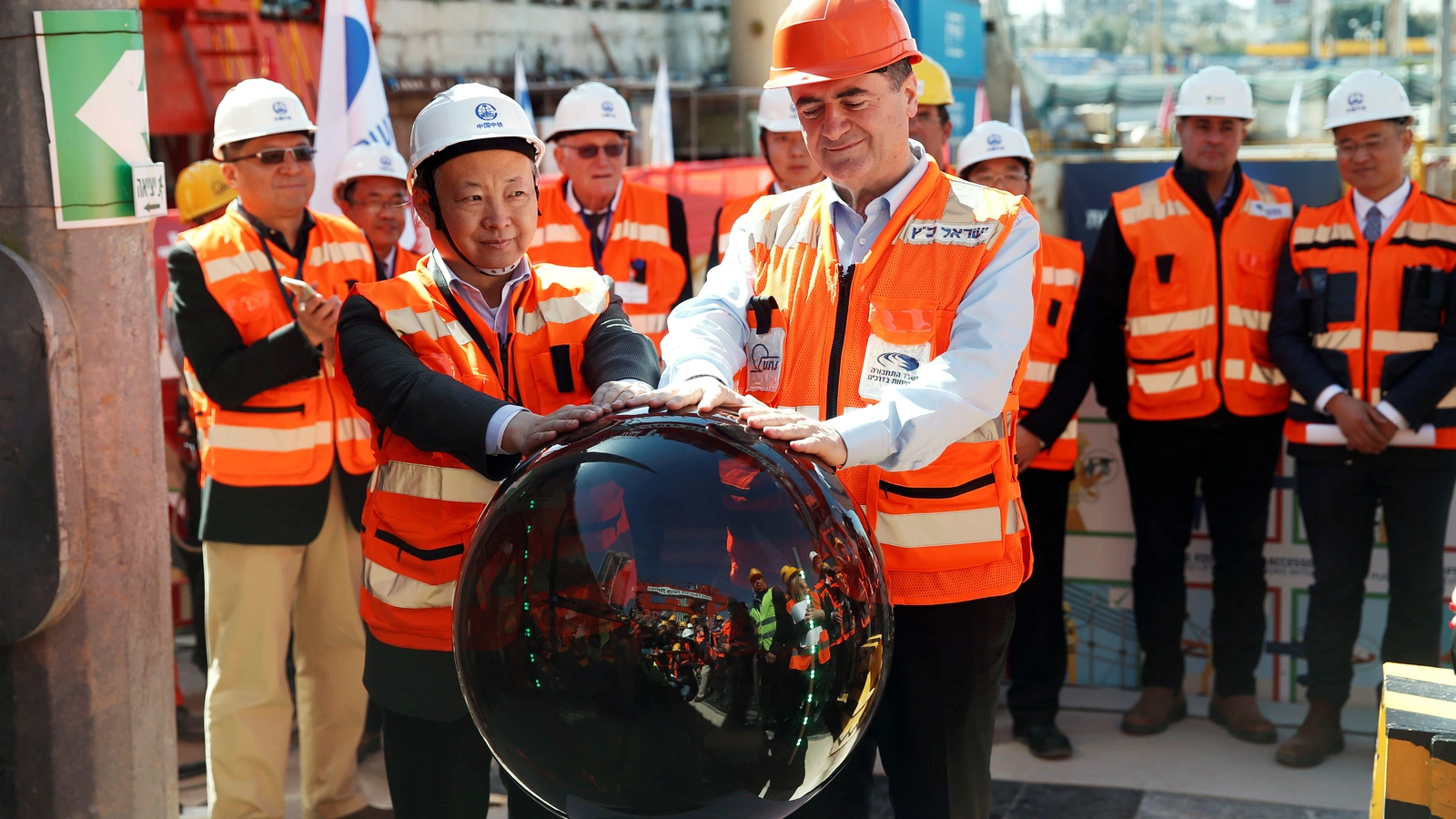 Israeli Transportation Minister Yisrael Katz and employees of China Railway Engineering Corporation mark the beginning of underground construction work on a light rail project in Tel Aviv. 