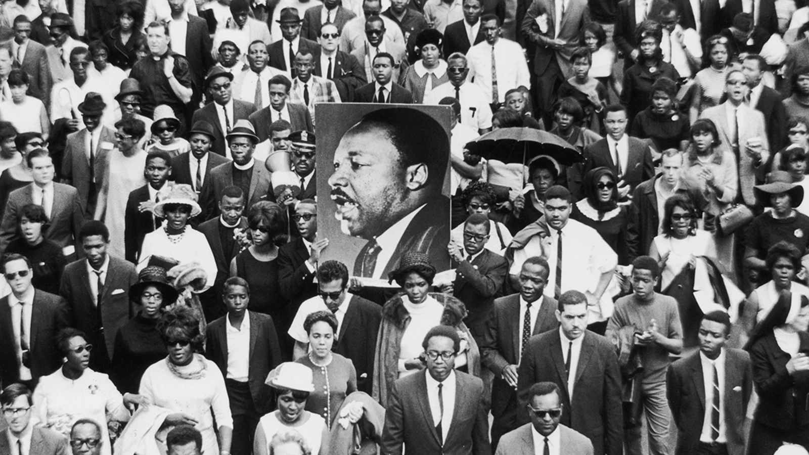 Mourners take part in a procession following the death of civil rights leader Martin Luther King, Jr., whose assassination was among the pivotal events of 1968.