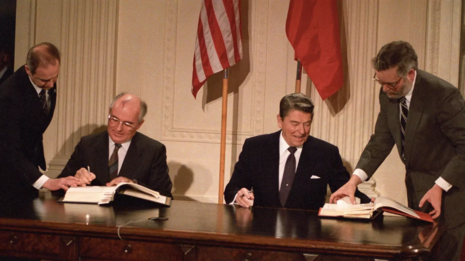 At their 1987 summit in Washington, President Ronald Reagan and Soviet leader Mikhail Gorbachev sign the Intermediate-Range Nuclear Forces treaty, a landmark arms control accord. 