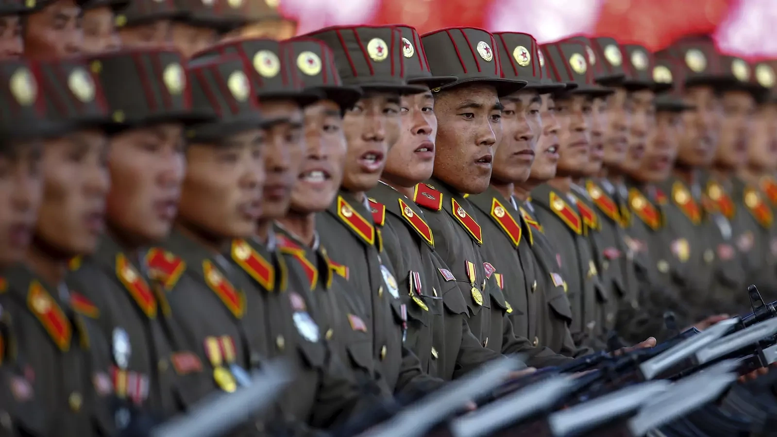 North Korean soldiers participate in a military parade overseen by the country's leader, Kim Jong-un, in Pyongyang on October 10, 2015.