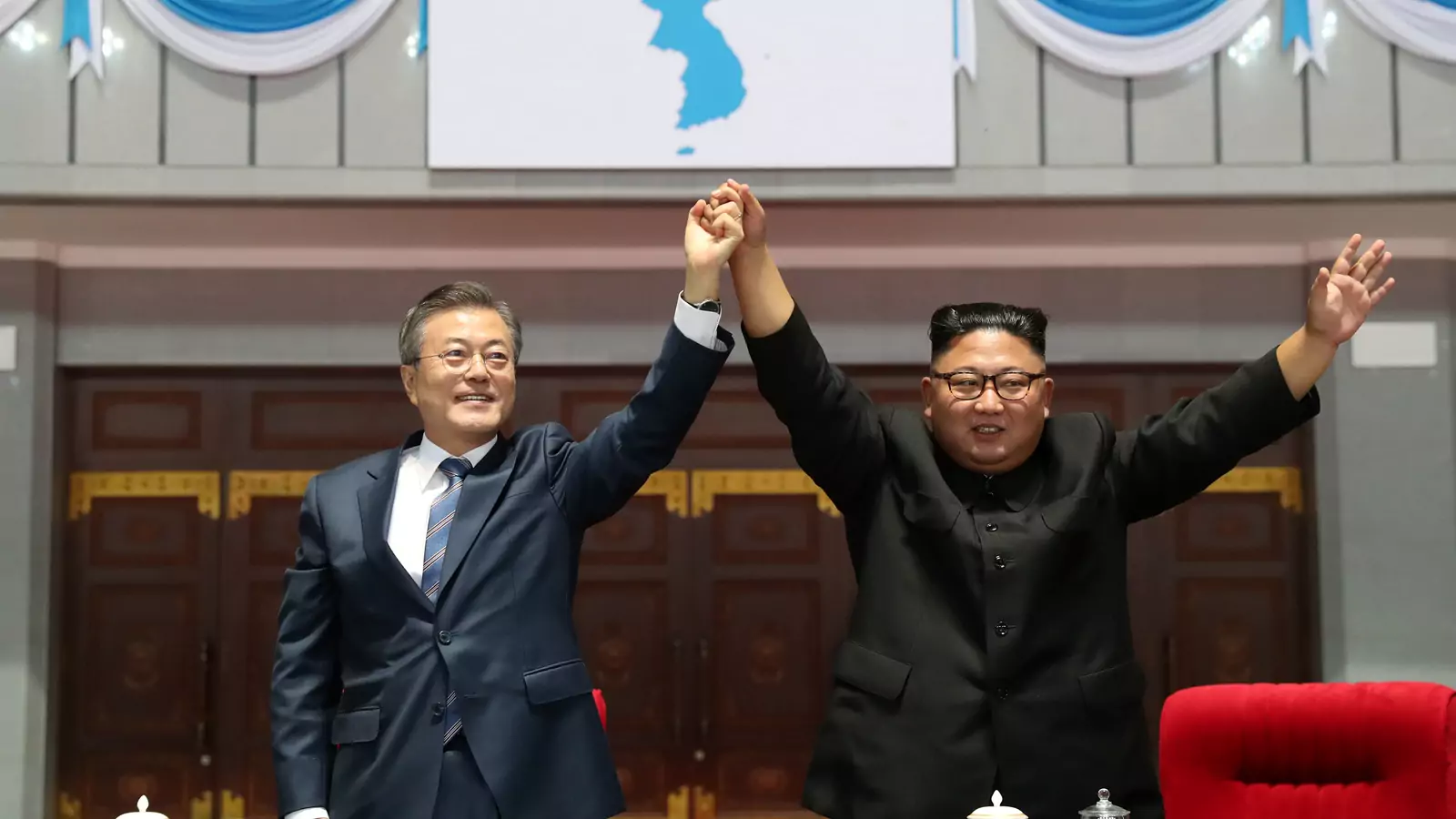 South Korean President Moon Jae-in and North Korean leader Kim Jong-un acknowledge the audience at the May Day Stadium in Pyongyang, North Korea