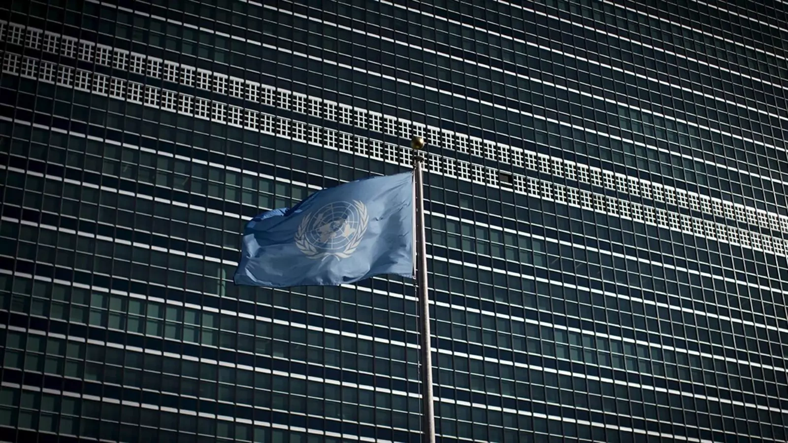 The United Nations flag flies in front of the organization's headquarters in New York in 2015.