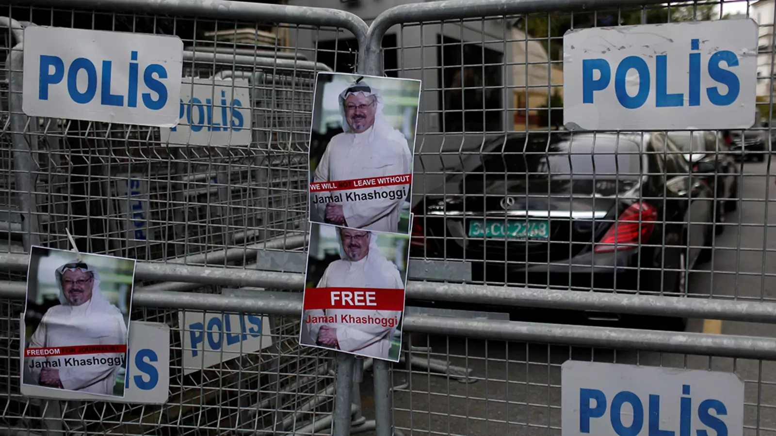 Pictures of Saudi journalist Khashoggi are placed on security barriers during a protest outside the Saudi Consulate in Istanbul, Turkey, October 8, 2018.
