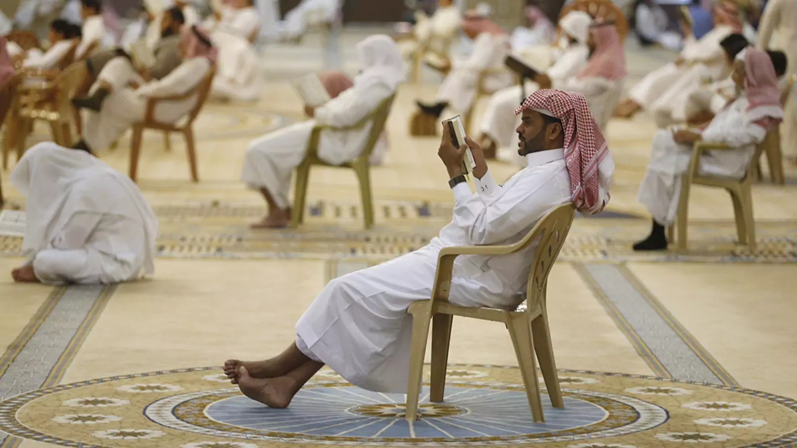 Men read the Koran during the holy month of Ramadan at a mosque near Riyadh, Saudi Arabia, in 2015.