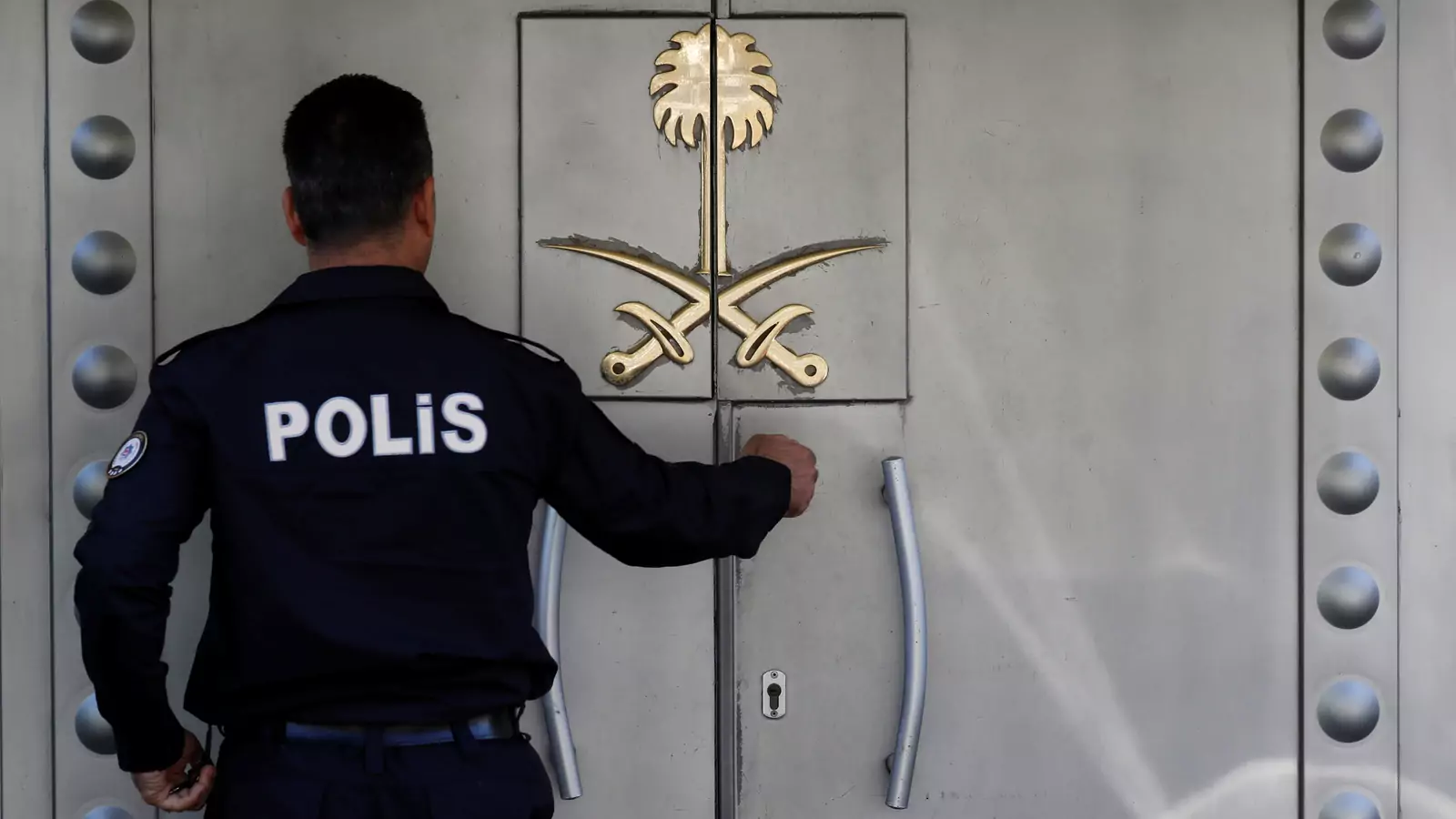 A Turkish police officer who stands guard at the Saudi Arabia's consulate is seen at the entrance, in Istanbul, Turkey October 10, 2018.