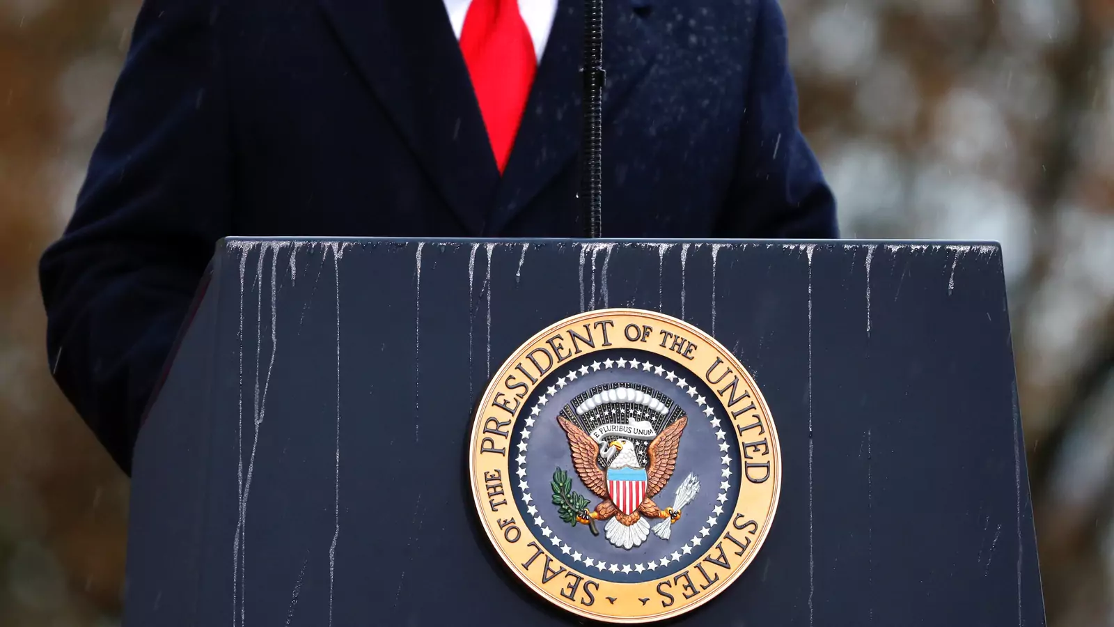 A lectern with presidential seal is pictured as U.S. President Donald Trump speaks.